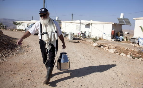 Colonişti evrei în Cisiordania. (Uriel Sinai / Getty Images)