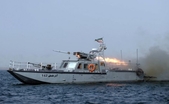 Navă iraniană de război trăgând cu rachete în Strâmtoarea Hormuz , 30 decembrie 2011 (ALI MOHAMMADI / AFP / Getty Images)