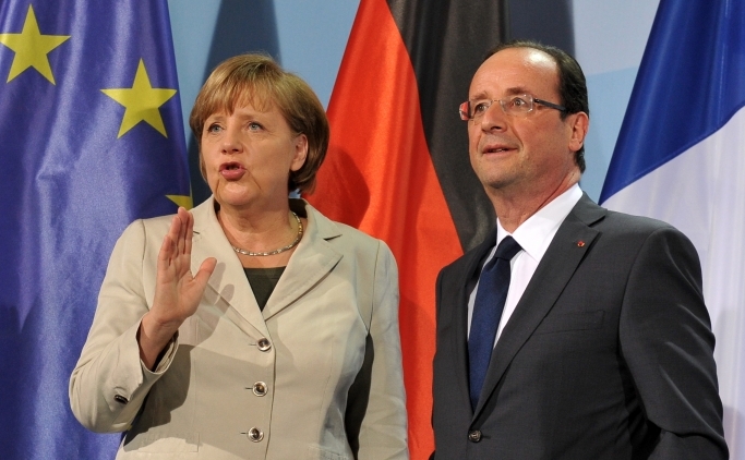 Cancelarul german, Angela Merkel şi preşedintele francez, Francois Hollande.
