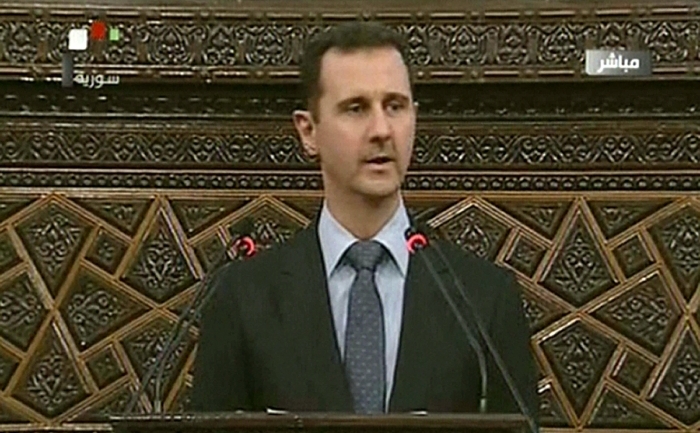 Imagine transmisă de televiziunea siriană - Bashar al-Assad adresându-se publicului, 3 iunie 2012 (DSK / AFP / GettyImages)