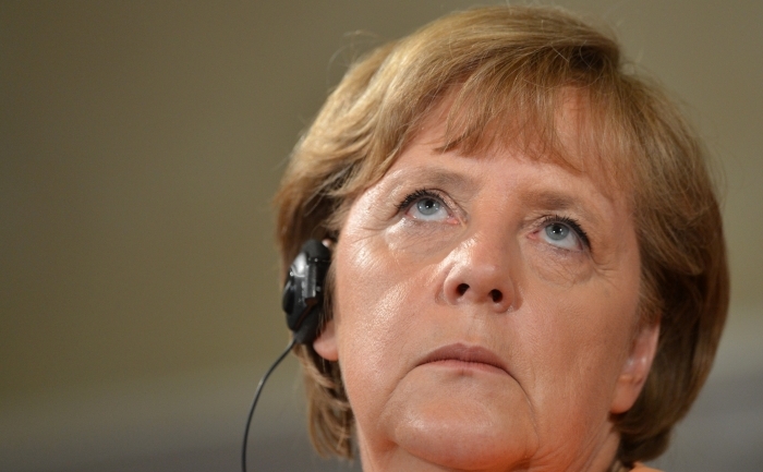 Cancelarul german Angela Merkel reacţionând în timpul  unei conferinţe de presă, Roma, Vila Madama, 4 iulie 2012