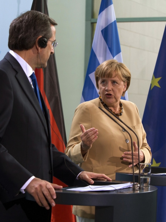 Cancelarul german Angela Merkel (R and Greek Prime Minister Antonis Samaras give a press conference on Aug. 24 at the Chancellery in Berlin. Pete Gannon / AFP / Getty Images)