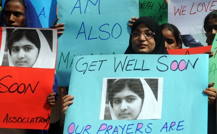 Susţinătorii tinerei Malala Yousafzai. (Arif Ali / AFP / Getty Images)