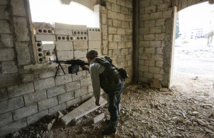 Rebel sirian Sirian în Maaret Al-Numan, 17 noiembrie 2012.
