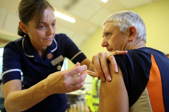 A member of the public is given an inoculation against swine flu at a medical centre in Cockermouth, England on Nov. 25, 2009. A new report warns that the effectiveness of the seasonal flu vaccine has been overstated.