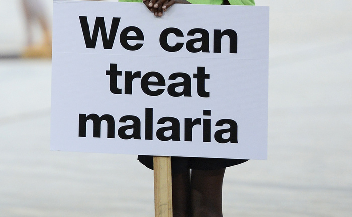 A girl stands next to an advertising banner for the fight against malaria during a ceremony held ahead of the 2013 African Cup of Nations final football match Nigeria vs Burkina Faso, on February 10, 2013 in Johannesburg.     AFP PHOTO / STEPHANE DE SAKUTIN        (Photo credit should read STEPHANE DE SAKUTIN/AFP/Getty Images) (STEPHANE DE SAKUTIN / AFP / Getty Images)