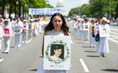 Marş de comemorare a practicanţilor Falun Gong omorâţi de Partidul Comunist Chinez. 17 iulie 2014 în Washington. (Larry Dye/The Epoch Times)