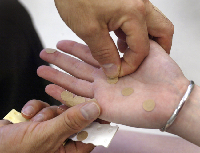 Acupunctura coreeană a mâinilor, nu necesită utilizarea de ace. (Foto:Tim Boyle/Getty Images/EET)