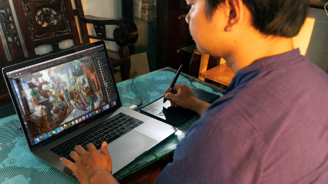 Loc Minh Duong lucrând la o pictură digitală. (Prin bunăvoinţa lui Loc Minh Duong)