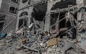 Clădiri avariate în Gaza (Abed Rahim Khatib / Getty Images)