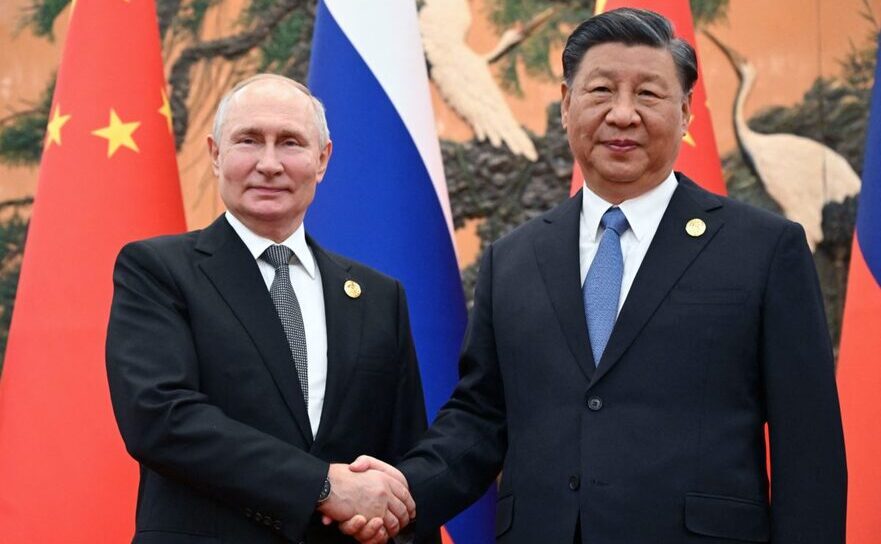 Vladimir Putin (st) şi Xi Jinping (Getty Images)
