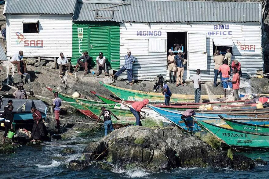 Pescarii au venit în masă pe insula Migingo pentru a profita de afacerea profitabilă a pescuitului de biban de Nil. (Yasuyoshi Chiba/AFP via Getty Images)